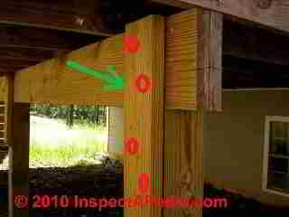 Scab to connect deck post to girder © D Friedman at InspectApedia.com 