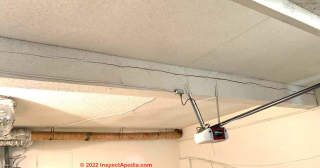 Split in garage ceiling beam (C) InspectApedia.com David