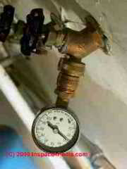 Water pressure test gauge on a hose bibb (C) Daniel Friedman