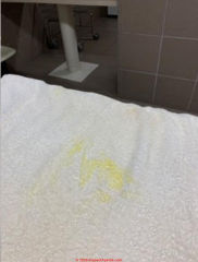 Yellow stains traced to water contaminants (C) InspectAPedia.com JH