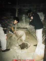 Basement dug well with unsafe cover (C) Daniel Friedman at InspectApedia.com
